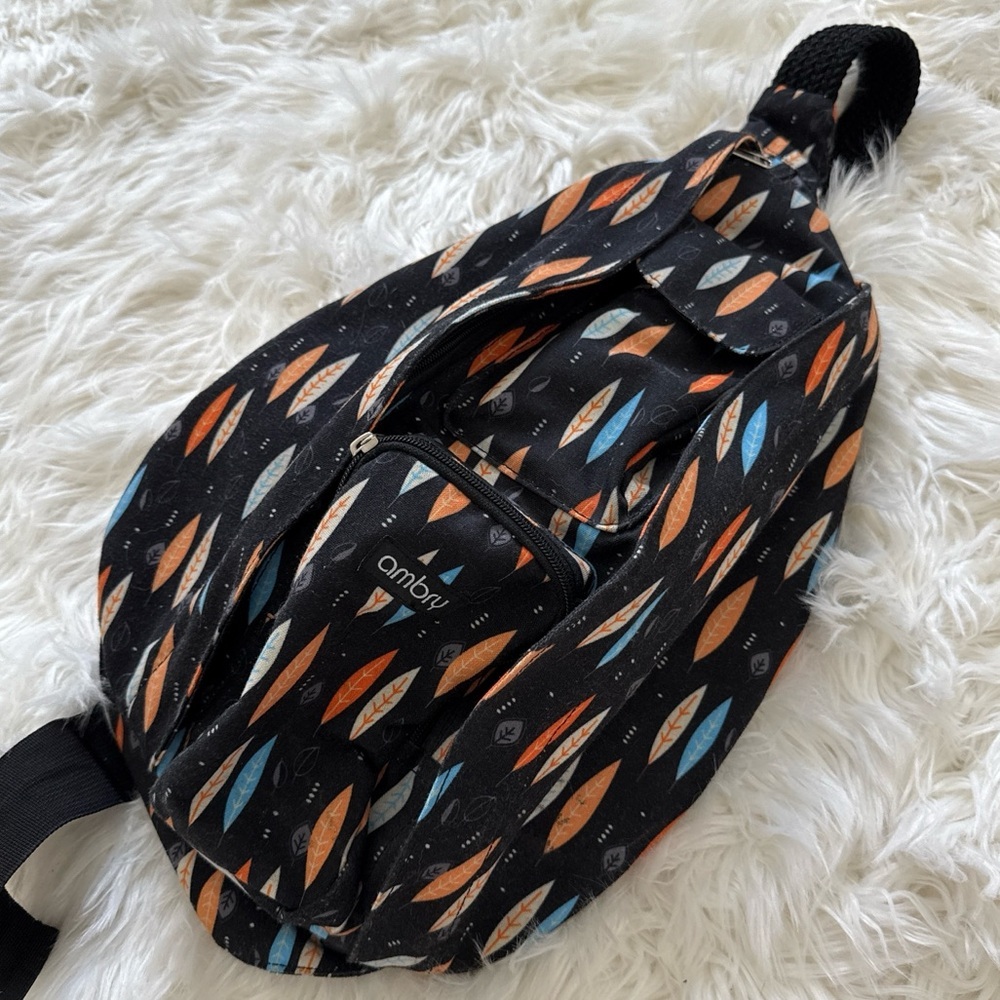 Black and Orange Geometric Backpack with Turquoise Accents